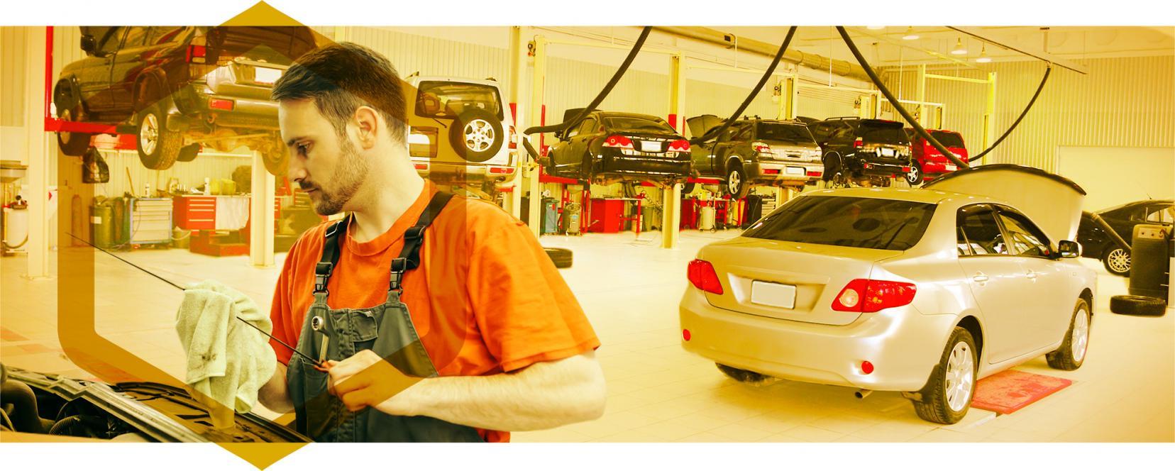 Man checking motor oil level in car